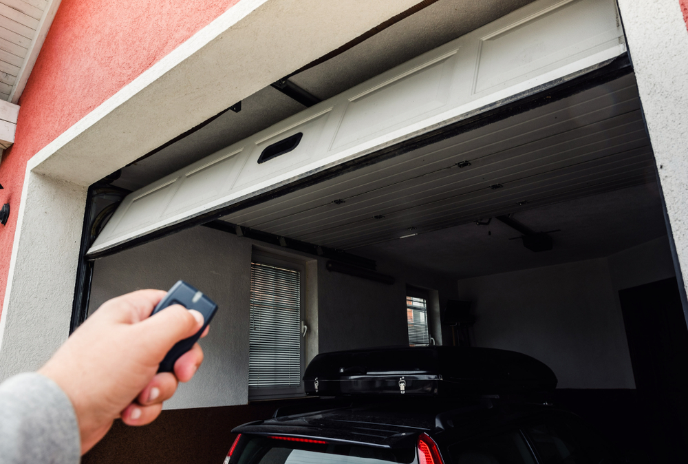 shutterstock_1112713106 Using a garage door remote to open the door