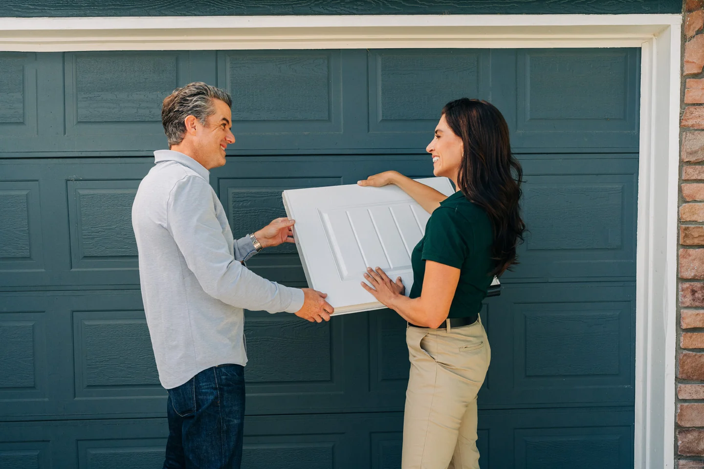 Garage door sales technician showing a panel design