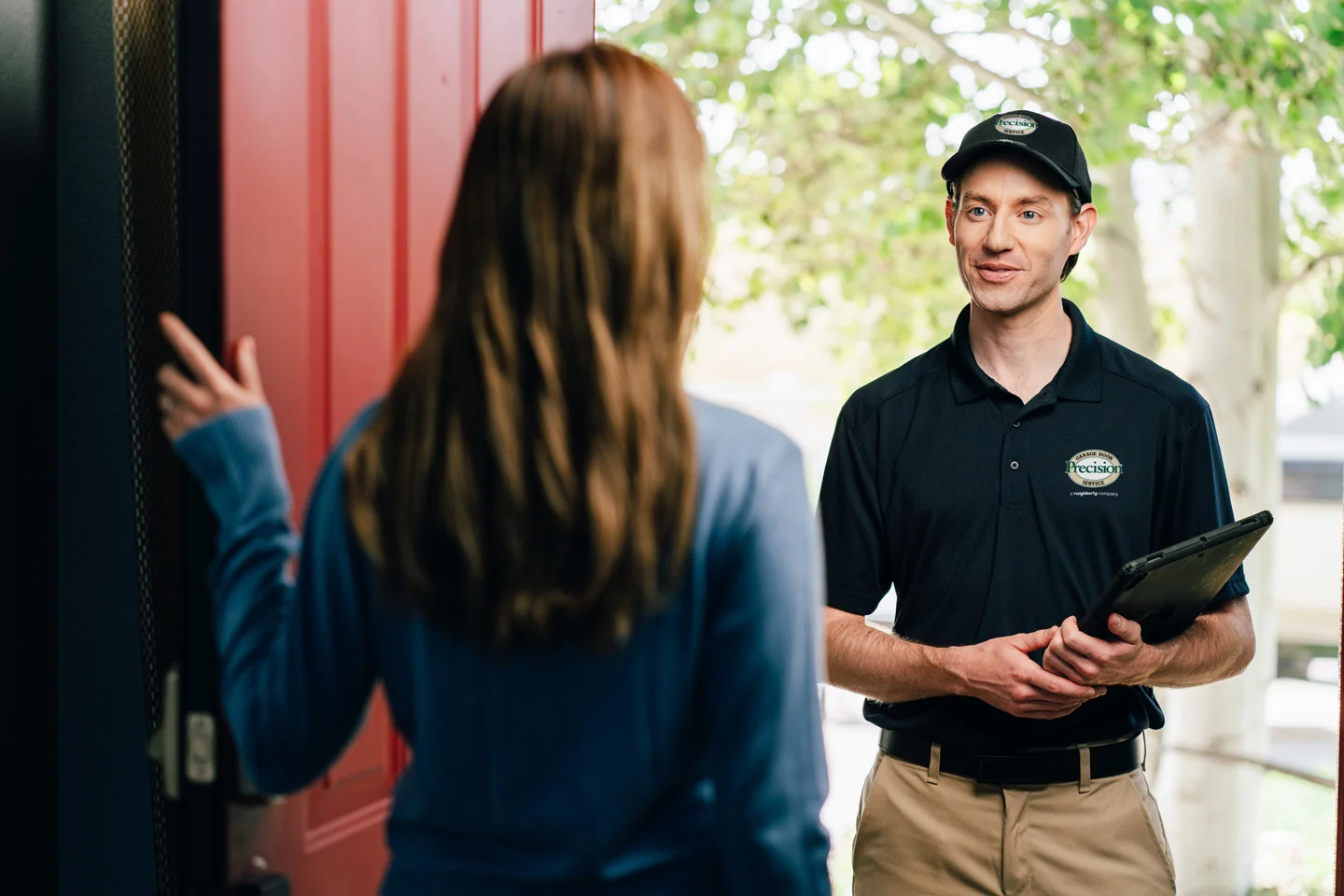 Garage door repair technician at customer's home Garage door repair technician at customer's home