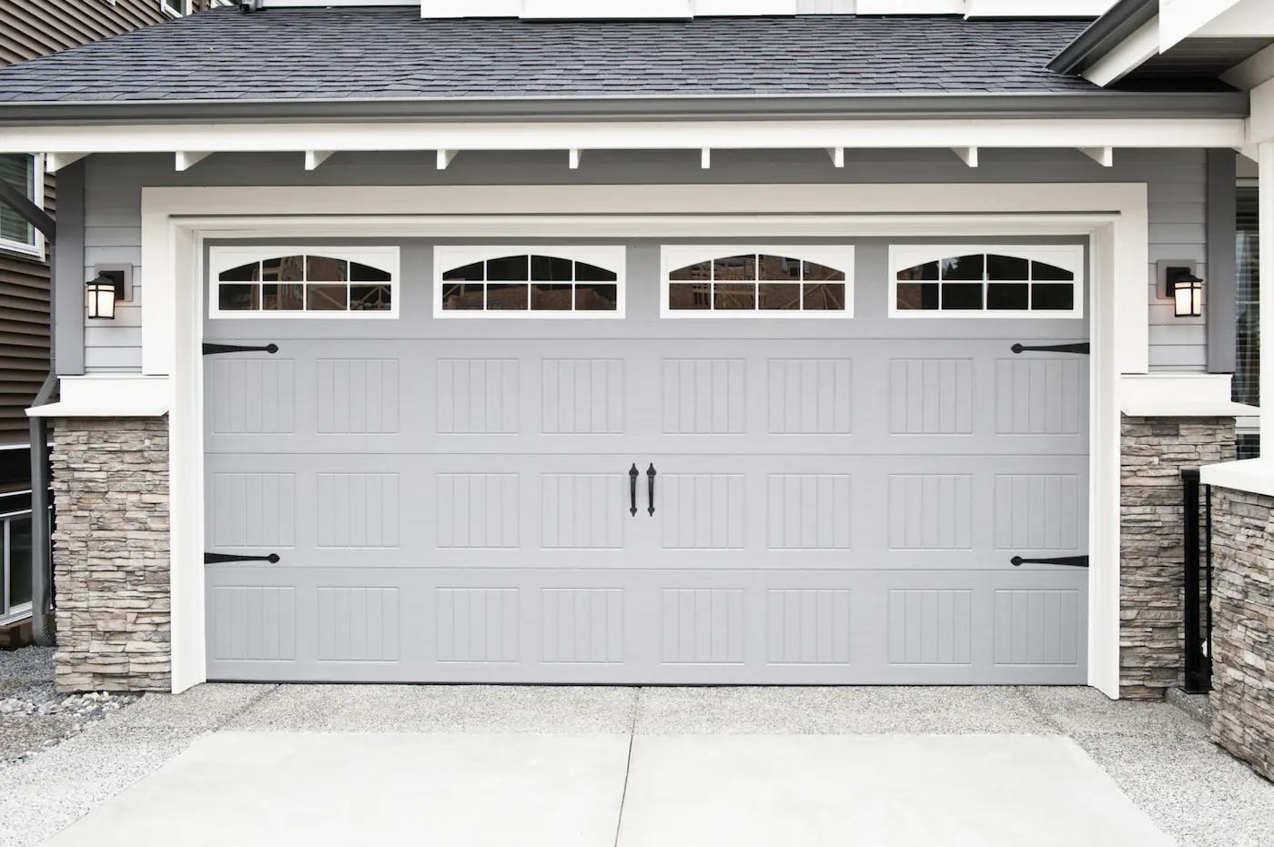 Gray garage door with decorative hardware Gray garage door with decorative hardware